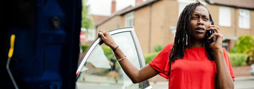 Woman on phone after a car accident