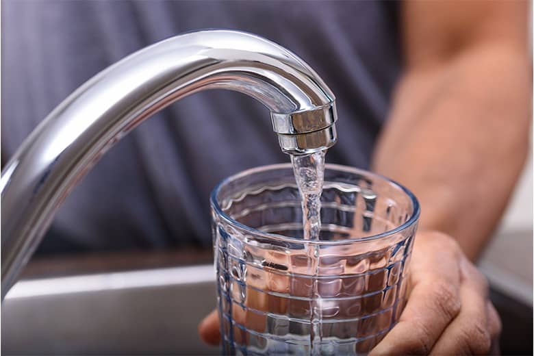 contaminated-toxic-water-man-filling-glass-from-faucet