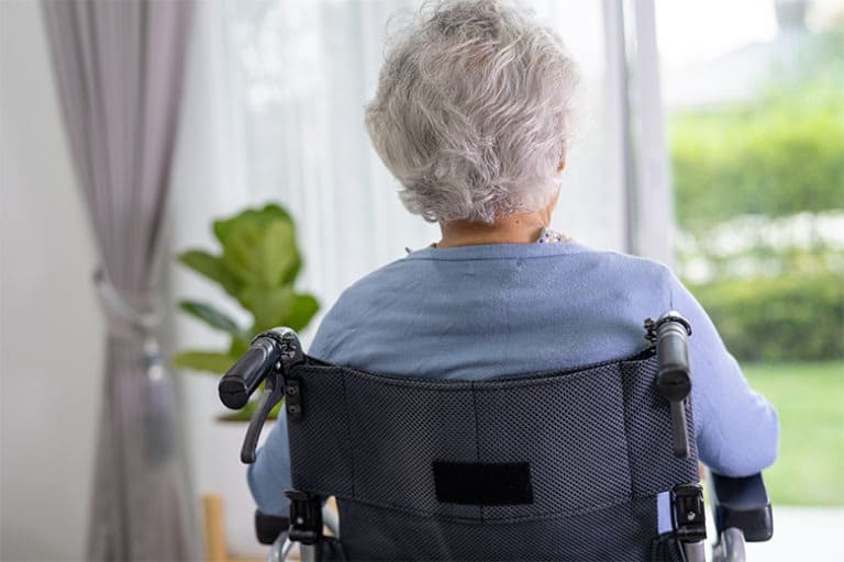 nursing-home-resident-sitting-alone-in-wheelchair