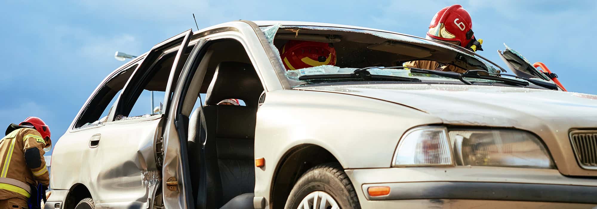 Damaged vehicle with first responders